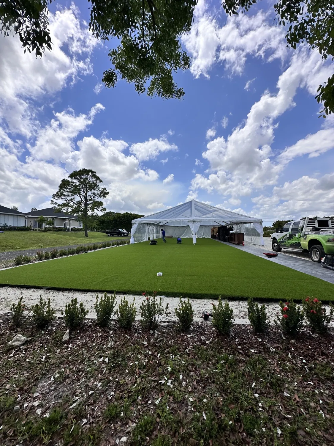 The same event space with a full turf lawn around the tent