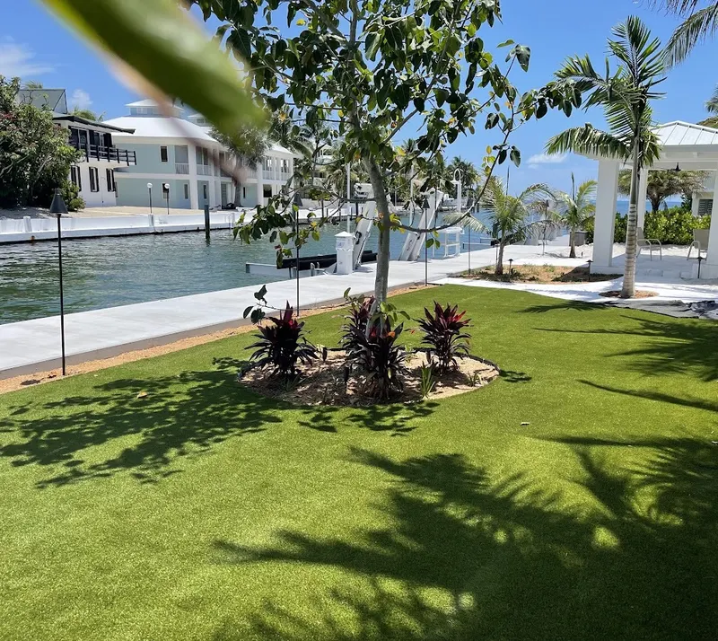 Turf lawn with a planted island along a canal seawall
