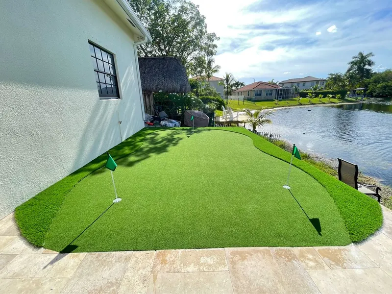 Putting green with fringe on a lakefront patio