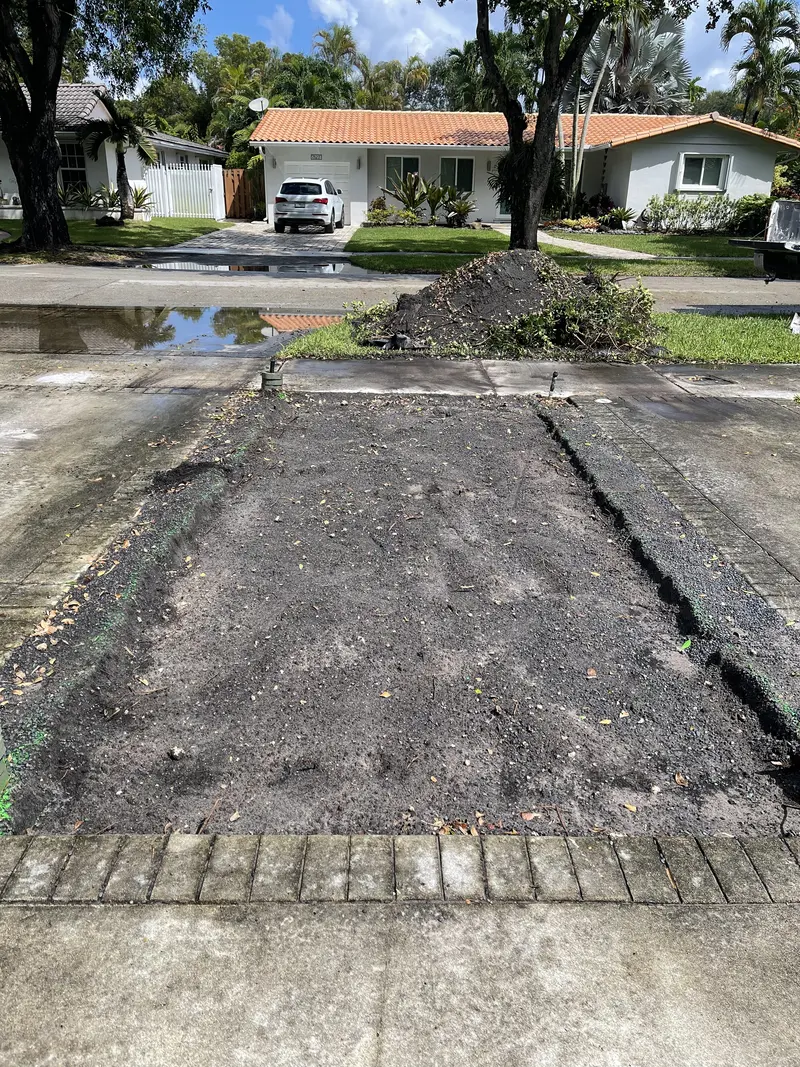 During the install: front-yard putting green in Hialeah Gardens, FL