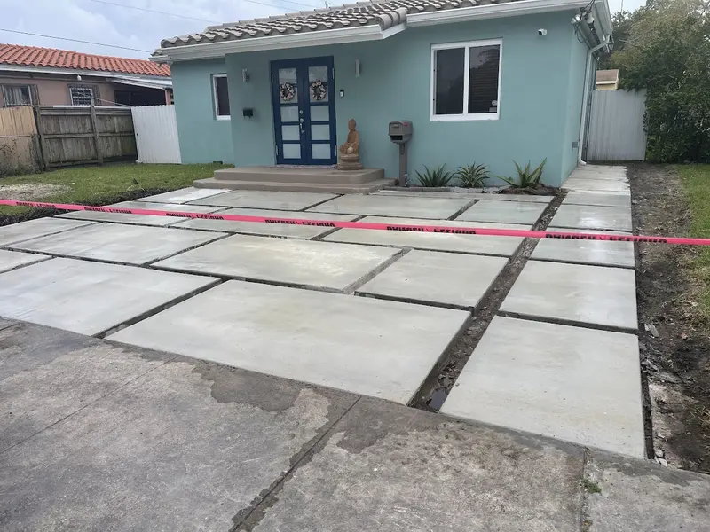 During the install: turf strips between driveway slabs in South Miami, FL