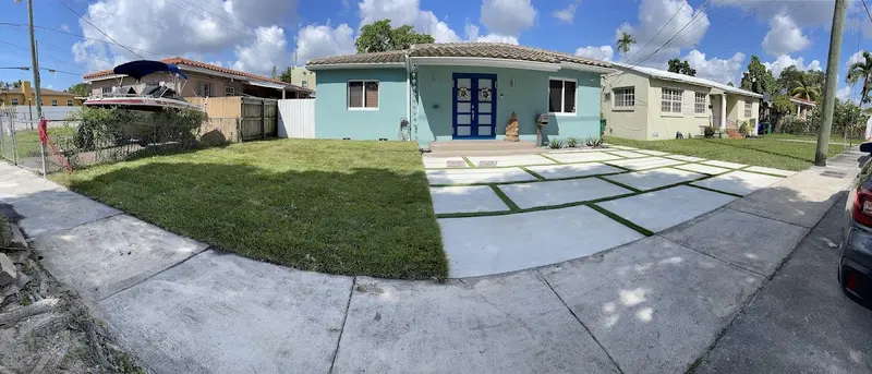After: turf strips between driveway slabs in South Miami, FL